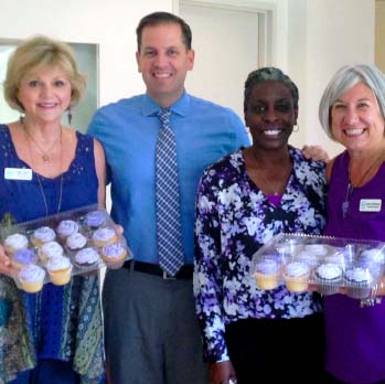 Clerk Roger Eaton and staff at a bake sale to raise funds for Domestic Violence Awareness Month