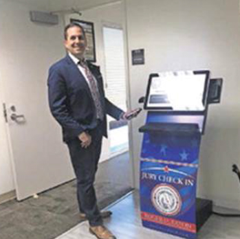 Roger D. Eaton, Clerk of the Circuit Court and County Comptroller at the Jury Check-In Kiosk