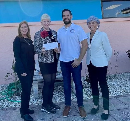 Roger D. Eaton, Clerk of the Circuit Court and County Comptroller  presents check to Suzanne Roberts, Chief Executive Officer of Virginia B. Andes.